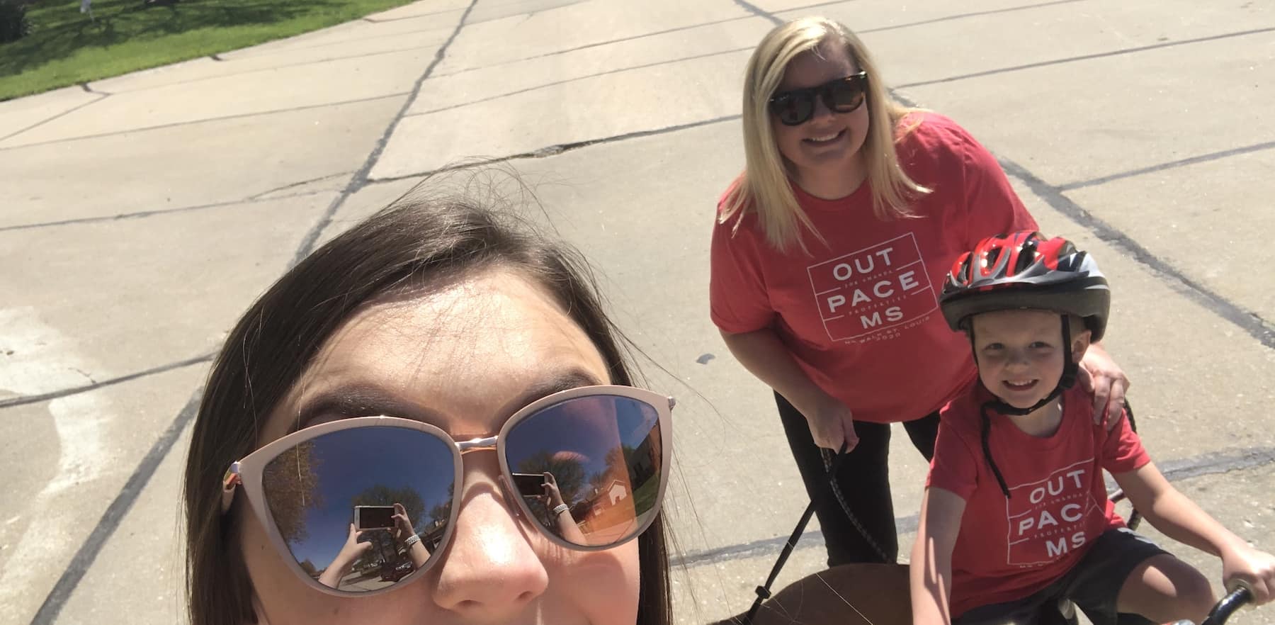 Family walking in neighborhood as virtual participants in Outpace MS 2020 fundraiser for the National Multiple Sclerosis Society